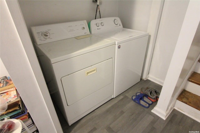 clothes washing area featuring dark hardwood / wood-style flooring and independent washer and dryer