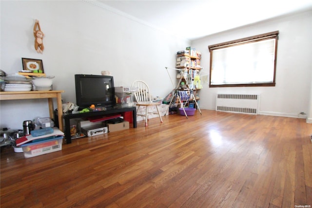 interior space featuring hardwood / wood-style flooring and radiator heating unit