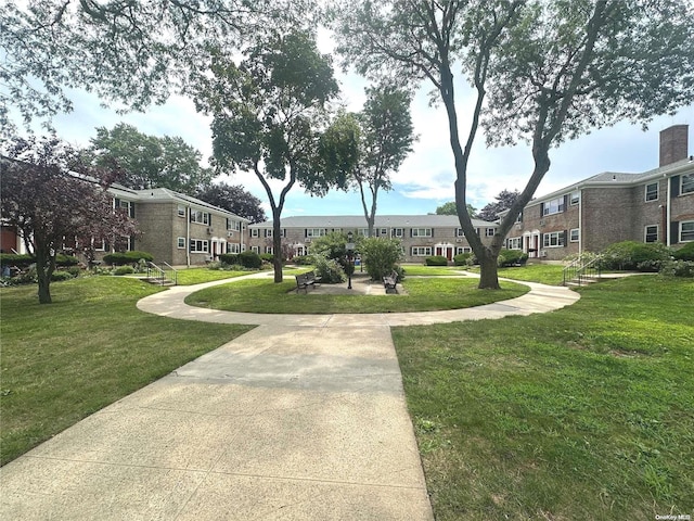 view of home's community featuring a yard