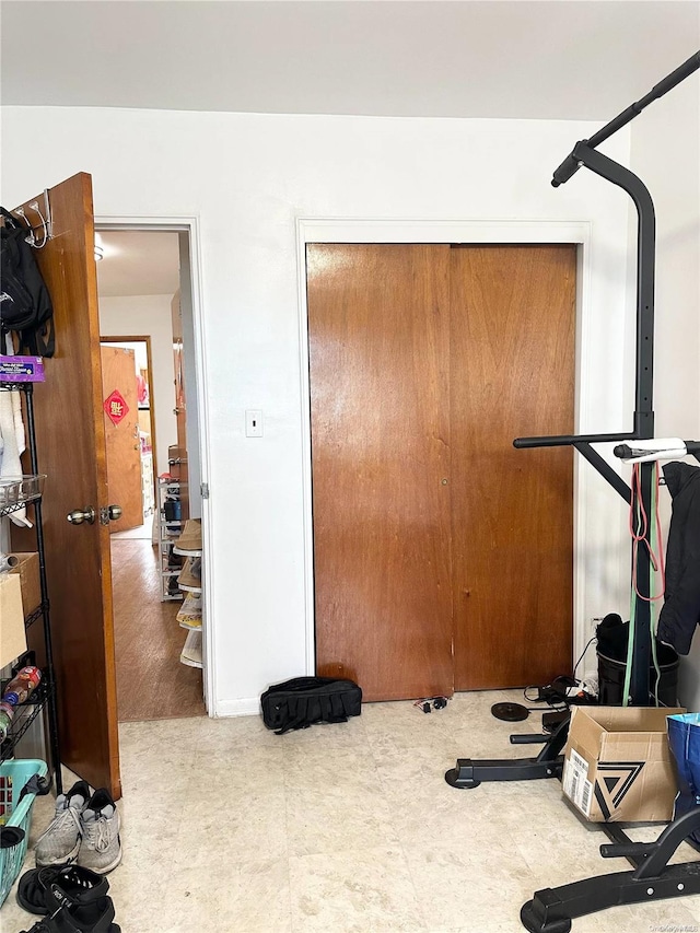 workout room with wood-type flooring