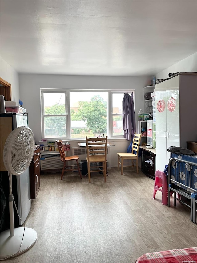 playroom with plenty of natural light and light wood-type flooring