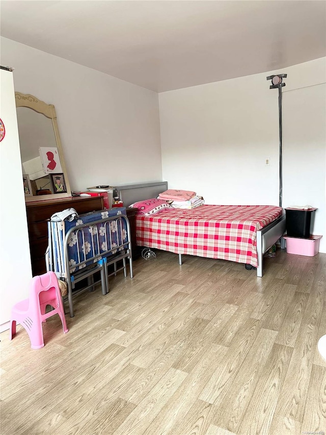 bedroom featuring light hardwood / wood-style flooring