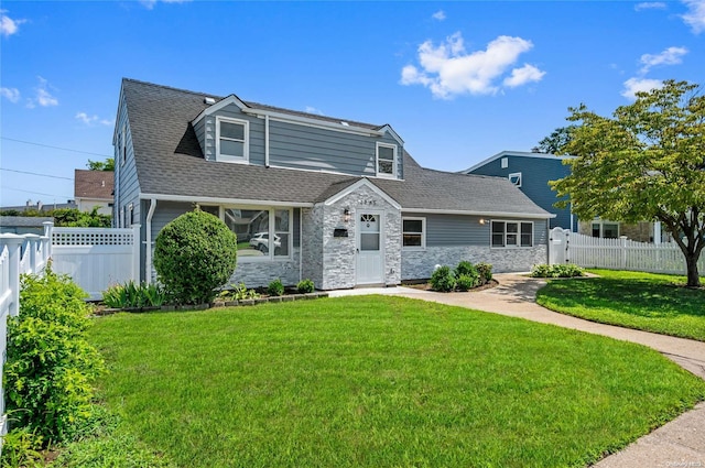 new england style home with a front lawn