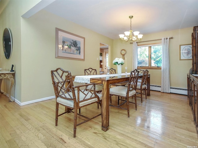 dining area with a chandelier, light wood-type flooring, and a baseboard radiator