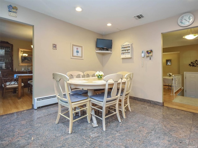 dining area featuring wood-type flooring