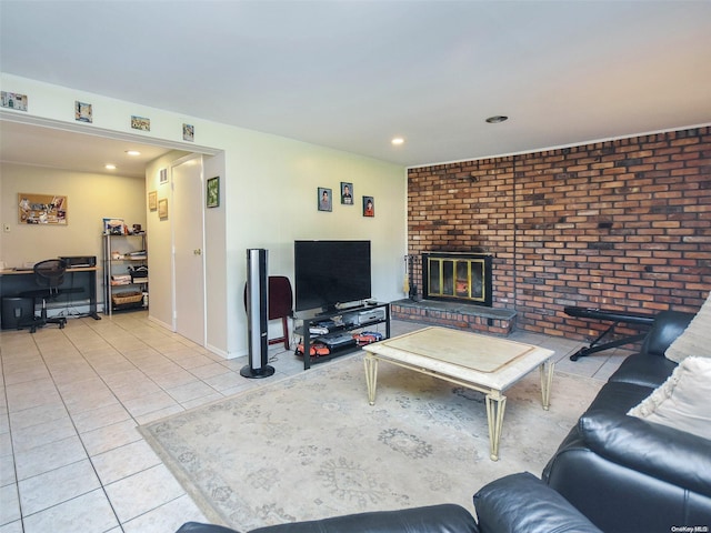 living room with a fireplace, light tile patterned flooring, and brick wall