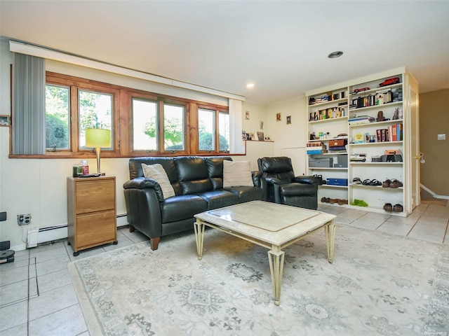 living room with light tile patterned floors and a baseboard heating unit