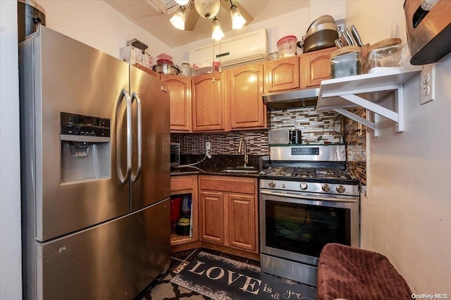 kitchen with sink, appliances with stainless steel finishes, and tasteful backsplash