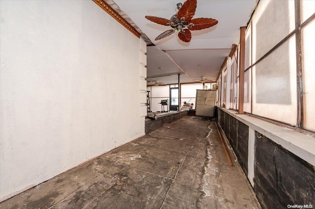 view of side of property with ceiling fan