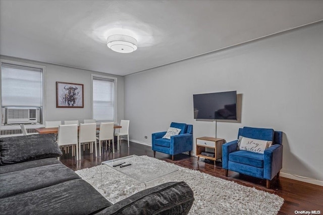 living room featuring cooling unit and dark wood-type flooring