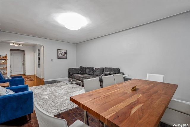 dining room with dark hardwood / wood-style floors