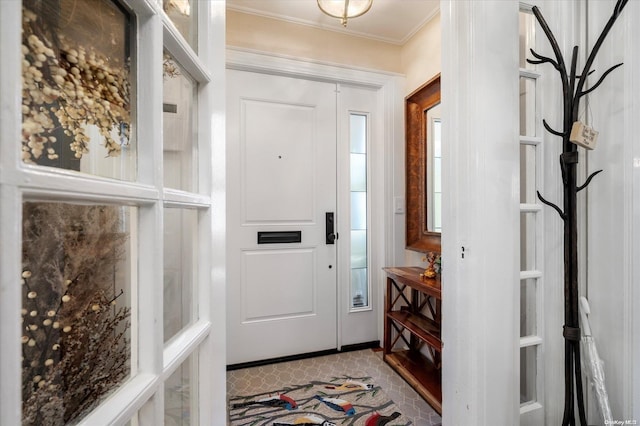 entryway featuring crown molding