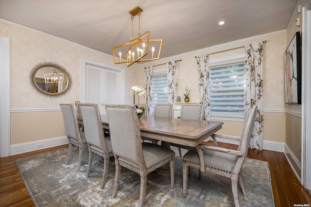 dining room with dark hardwood / wood-style flooring and a chandelier