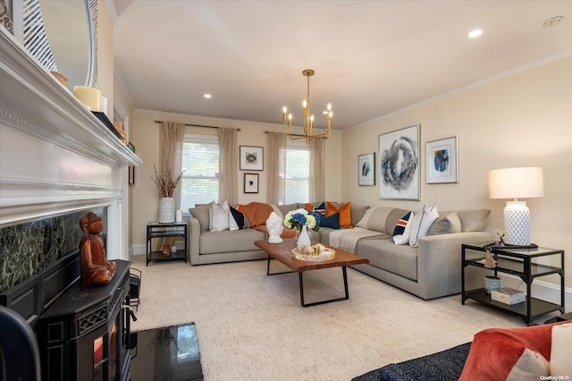 carpeted living room with a notable chandelier and ornamental molding