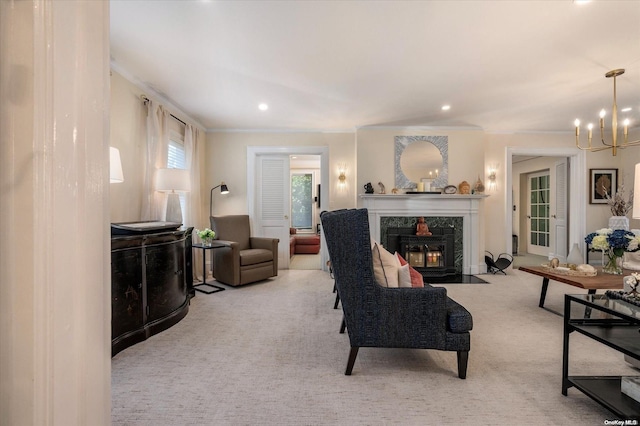 carpeted living room with ornamental molding and an inviting chandelier