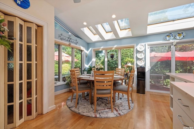 sunroom / solarium featuring vaulted ceiling and a wealth of natural light