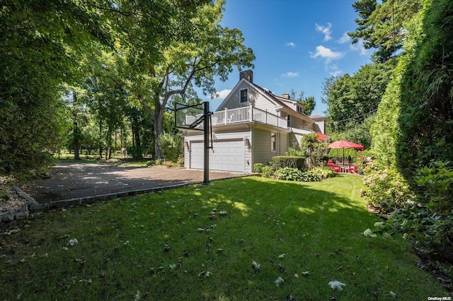 view of property exterior featuring a yard and a balcony