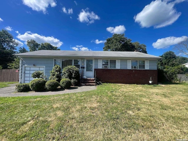 single story home with a front yard and a garage