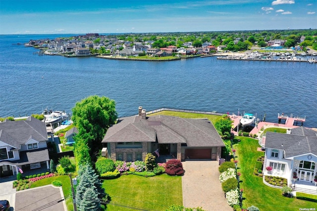 bird's eye view featuring a residential view and a water view