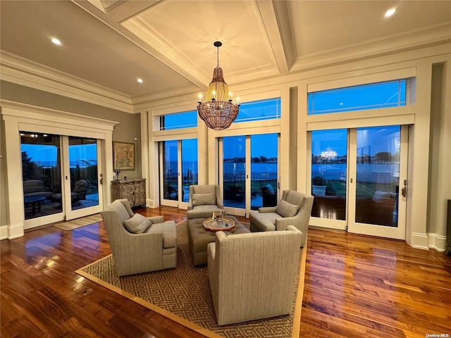 sunroom / solarium with an inviting chandelier, coffered ceiling, and beam ceiling