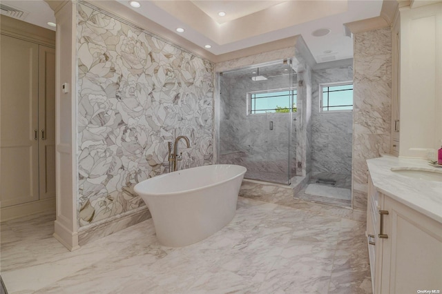 full bathroom with a marble finish shower, visible vents, marble finish floor, a freestanding bath, and vanity