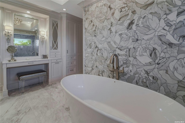 full bath with marble finish floor, stone wall, a freestanding bath, and recessed lighting