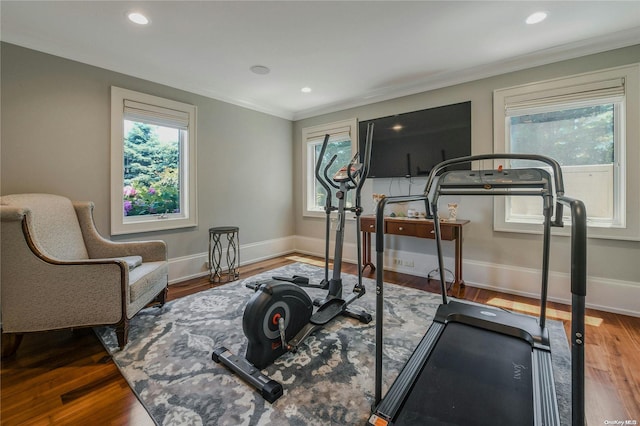 exercise area featuring recessed lighting, baseboards, and wood finished floors