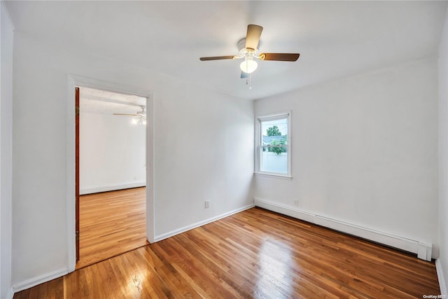 unfurnished bedroom featuring hardwood / wood-style floors, a closet, ceiling fan, and a baseboard heating unit