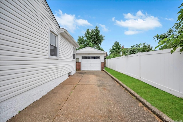 exterior space with an outdoor structure and a garage