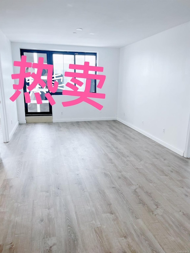 empty room with light wood-type flooring