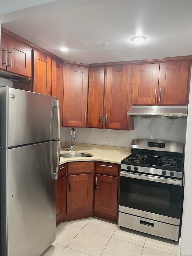 kitchen featuring sink, light tile patterned flooring, and appliances with stainless steel finishes