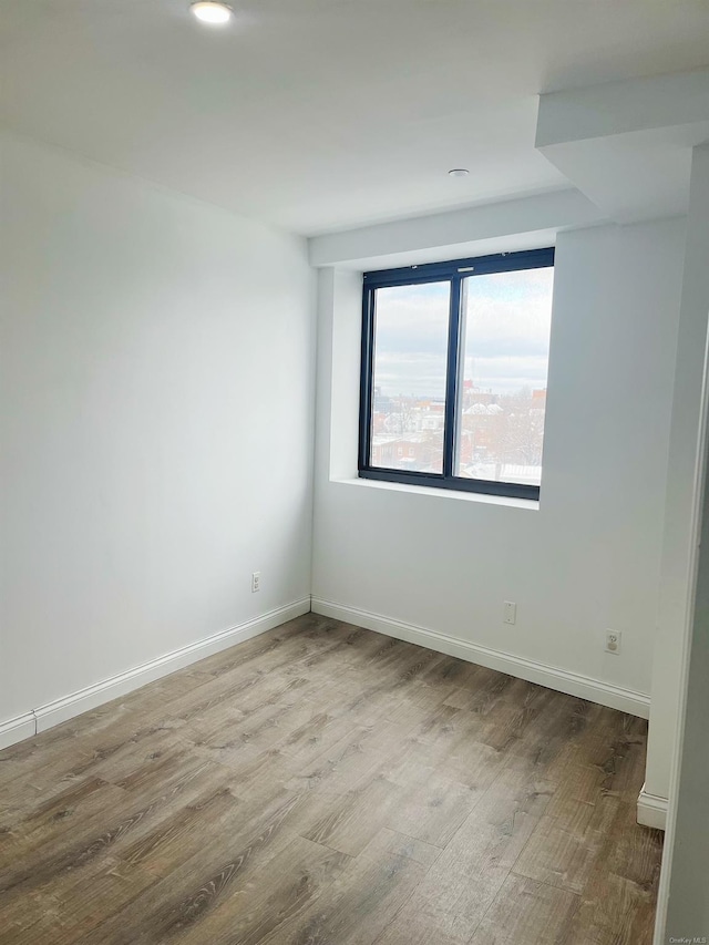 empty room featuring hardwood / wood-style floors