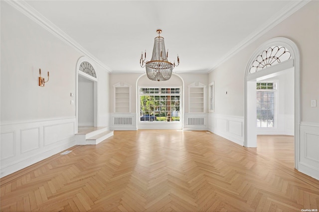 unfurnished living room with built in shelves, ornamental molding, and light parquet floors