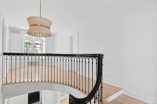 staircase featuring hardwood / wood-style floors