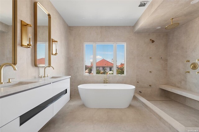 65 W Beech St, Long Beach, NY 11561 - bathroom with double vanity, a soaking tub, and tiled shower