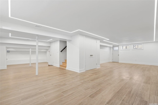 basement featuring light wood-type flooring