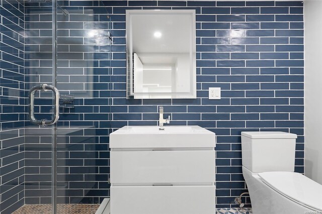 65 W Beech St, Long Beach, NY 11561 - full bath with vanity, a stall shower, toilet, and tile walls