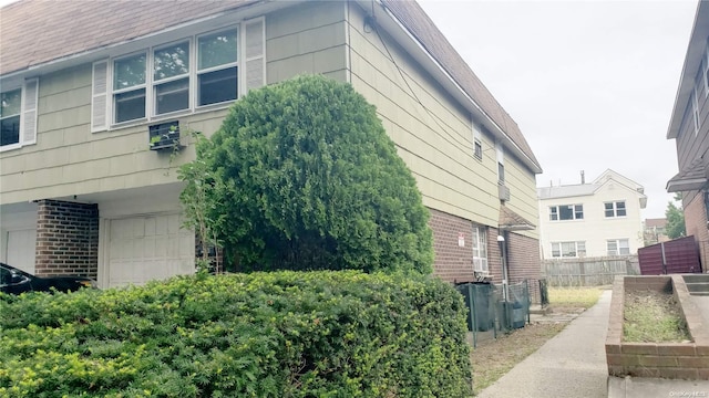 view of property exterior featuring a garage