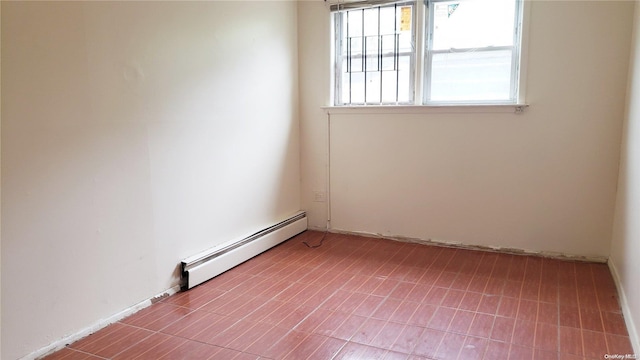 empty room featuring a baseboard radiator