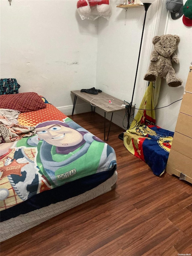 bedroom featuring dark wood-type flooring