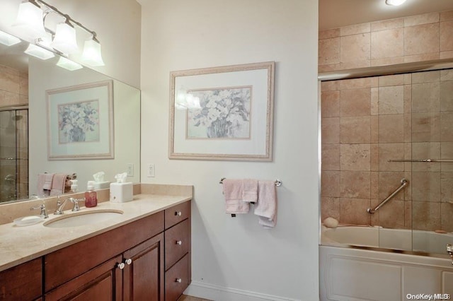 bathroom with vanity and enclosed tub / shower combo