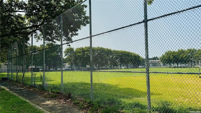 view of property's community with a lawn