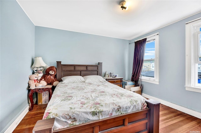 bedroom featuring wood-type flooring