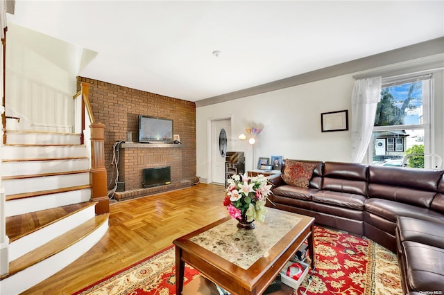 living room with a fireplace and parquet flooring