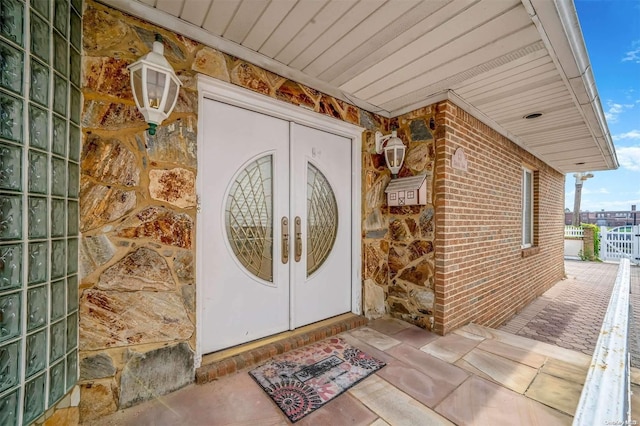 property entrance featuring french doors