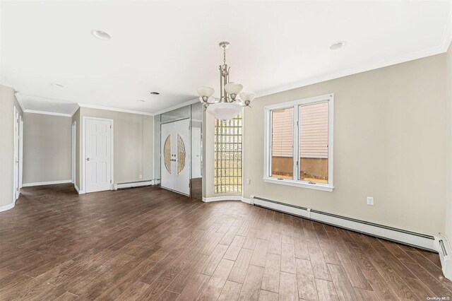 interior space featuring dark hardwood / wood-style flooring, a baseboard radiator, an inviting chandelier, and crown molding