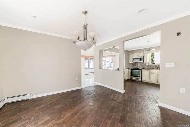 unfurnished dining area featuring hardwood / wood-style floors, a notable chandelier, baseboard heating, and crown molding