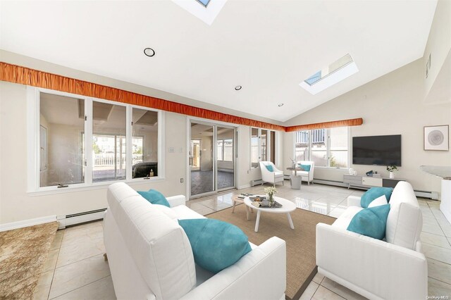 tiled living room featuring high vaulted ceiling, a skylight, a wealth of natural light, and a baseboard heating unit