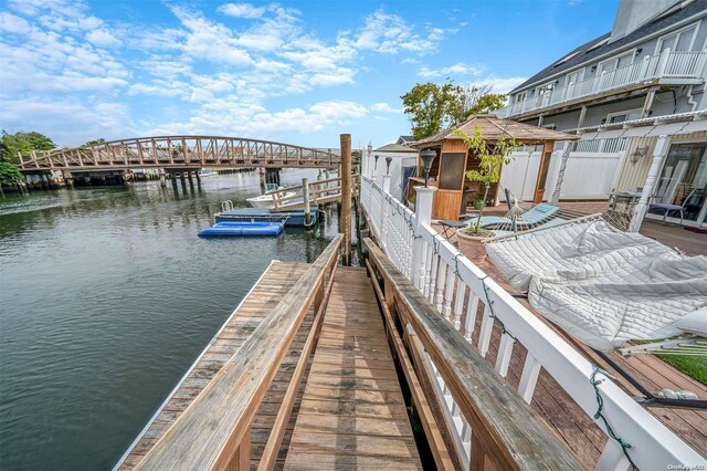 dock area with a gazebo and a water view