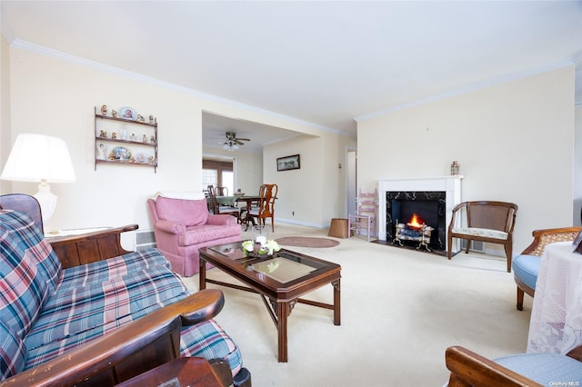 living room featuring a high end fireplace, carpet, ceiling fan, and ornamental molding